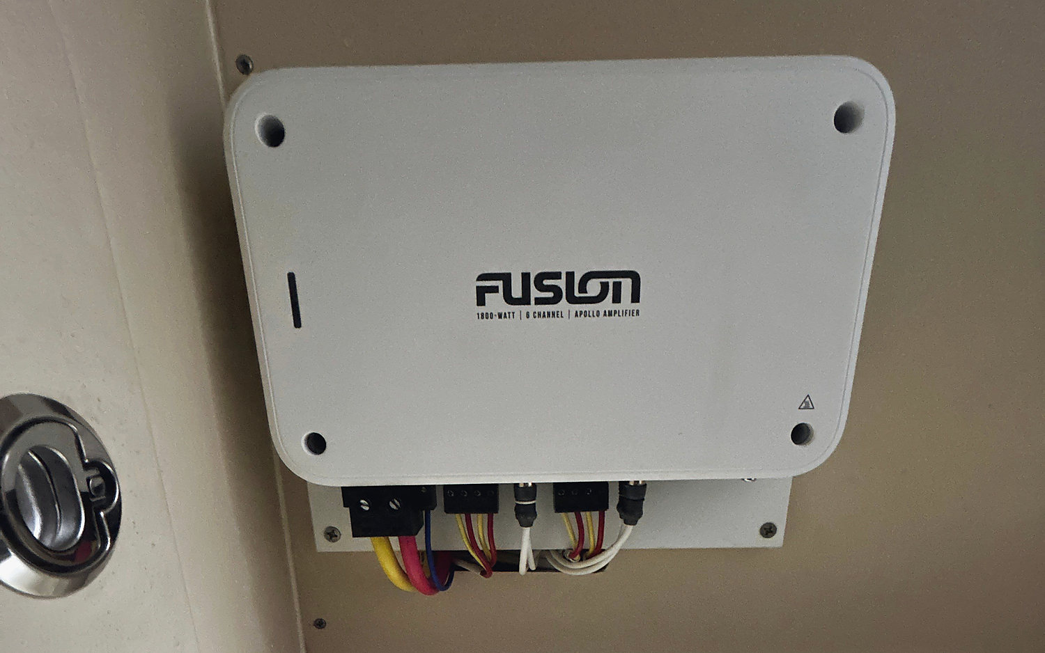 A Fusion marine amplifier mounted on a locker wall