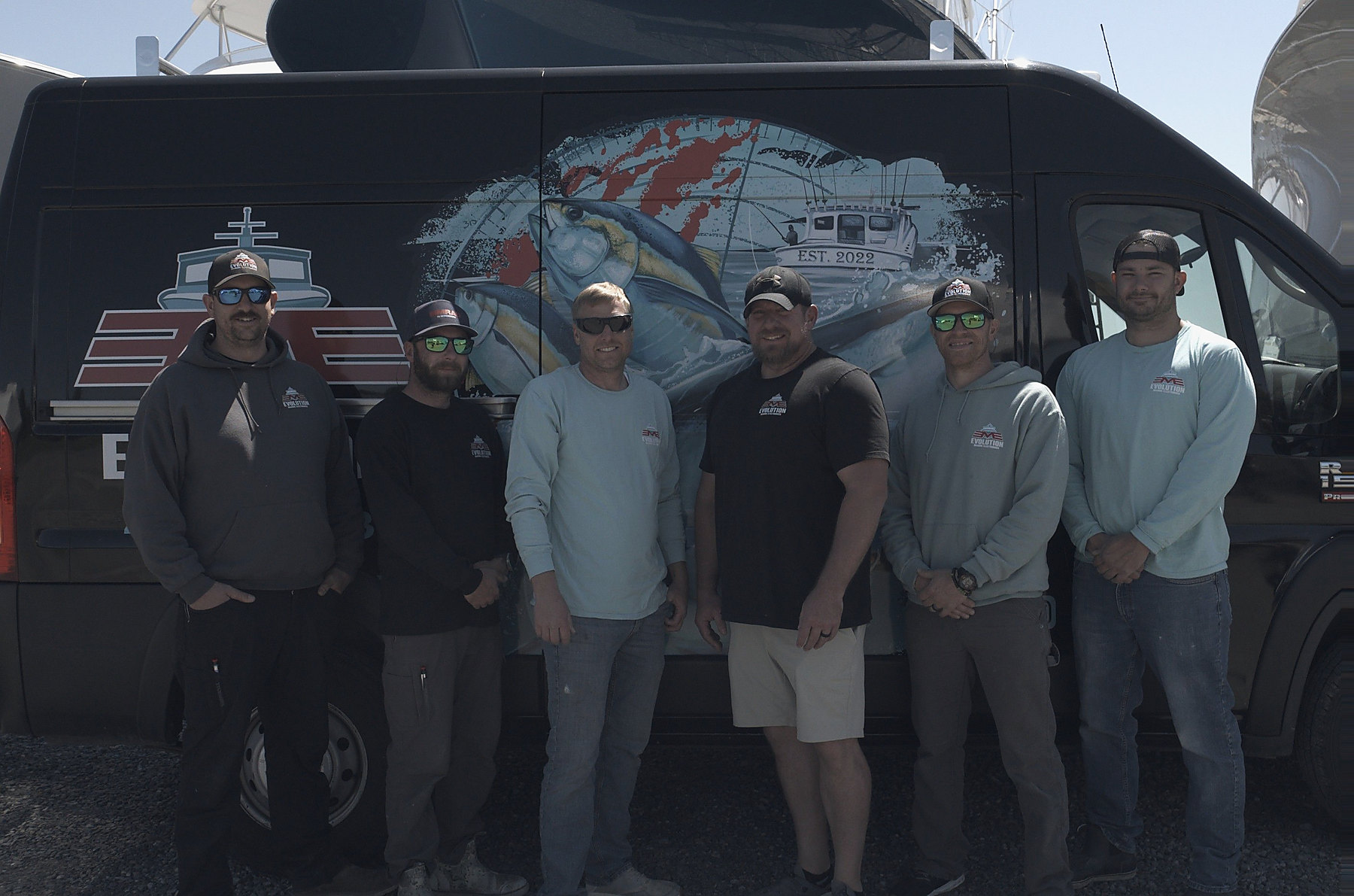 The Evolution Marine Electronics team in front of the shop van: Joe, John, Chris, Josh, Wink and Jacob